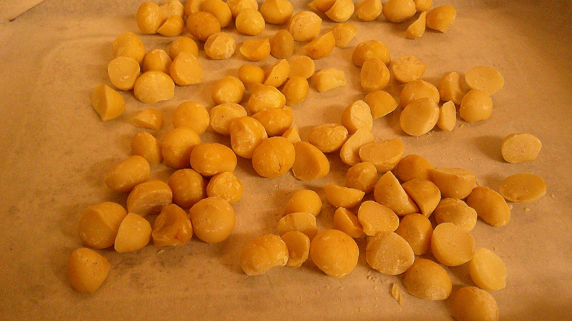 Macadamia nuts on a pan.