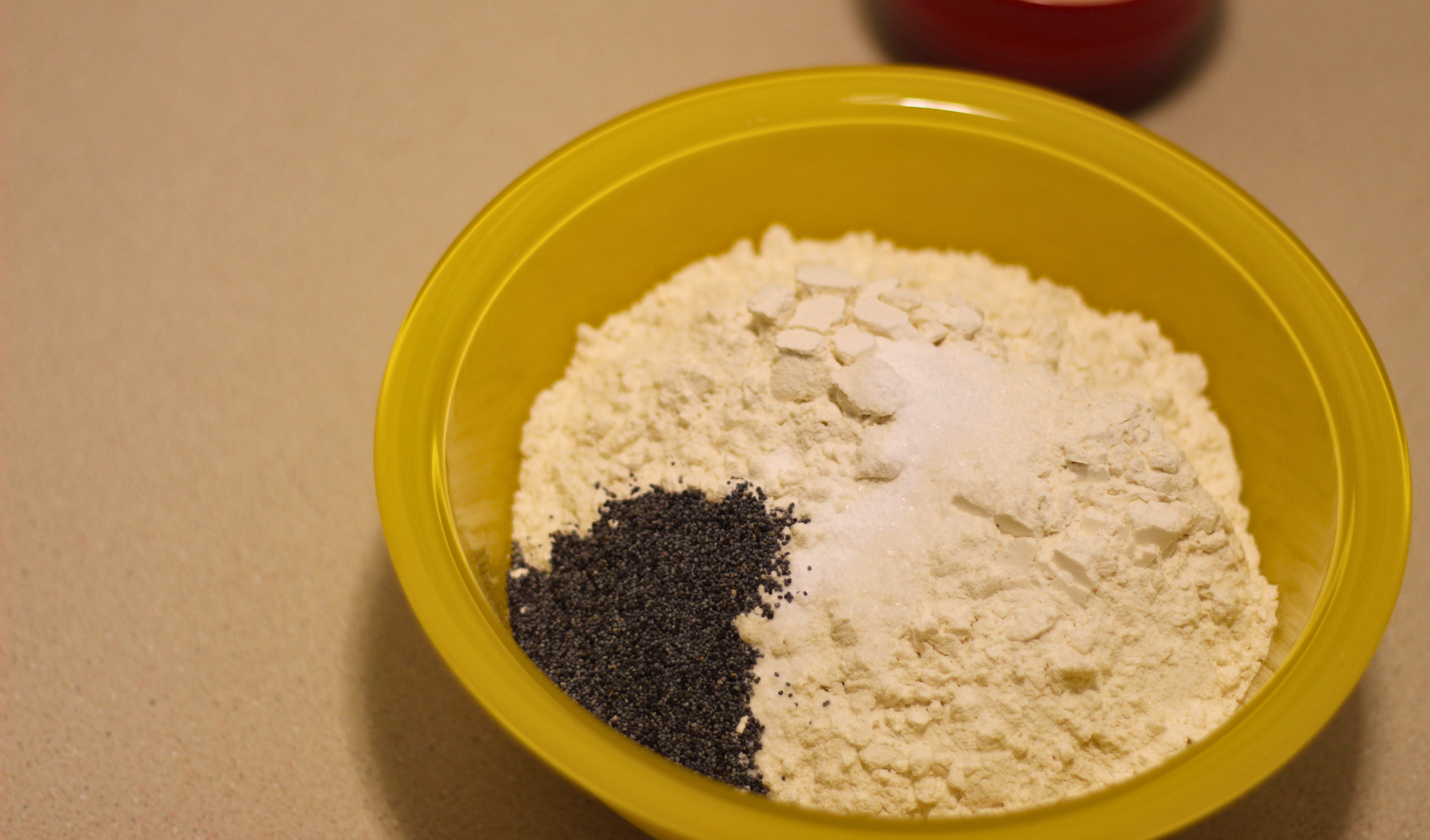 Flour, poppy seeds, and salt in a bowl.