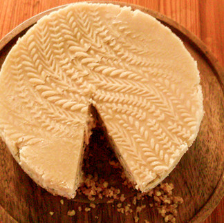 A cheesecake with marzipan on top.
