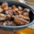 Seasoned BBQ chicken wings and roasted potatoes prepared with Southern flavors at Double’s BBQ & Soul Food Experience.