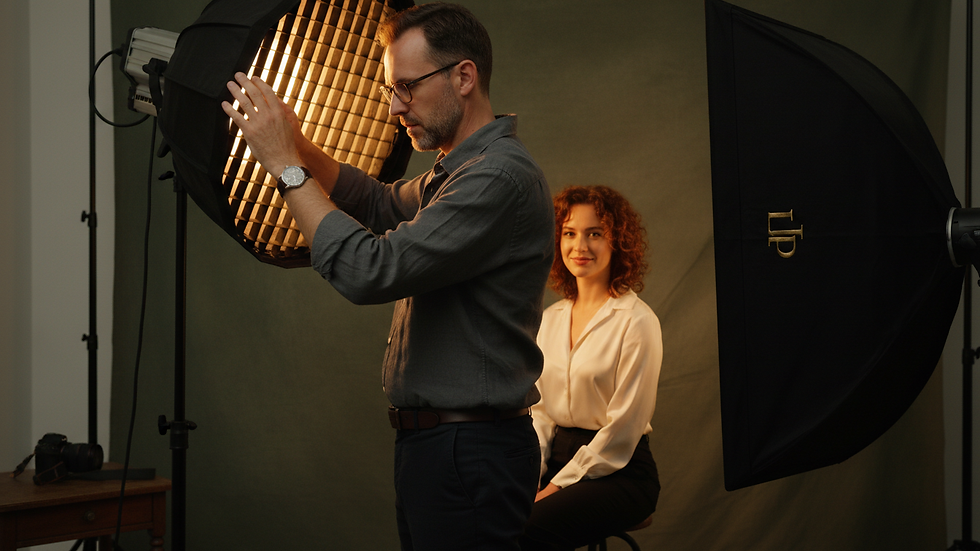 Close-up view of a photographer adjusting lighting for a headshot session