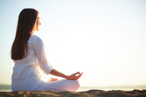 woman-sitting-yoga-pose-beach.jpg