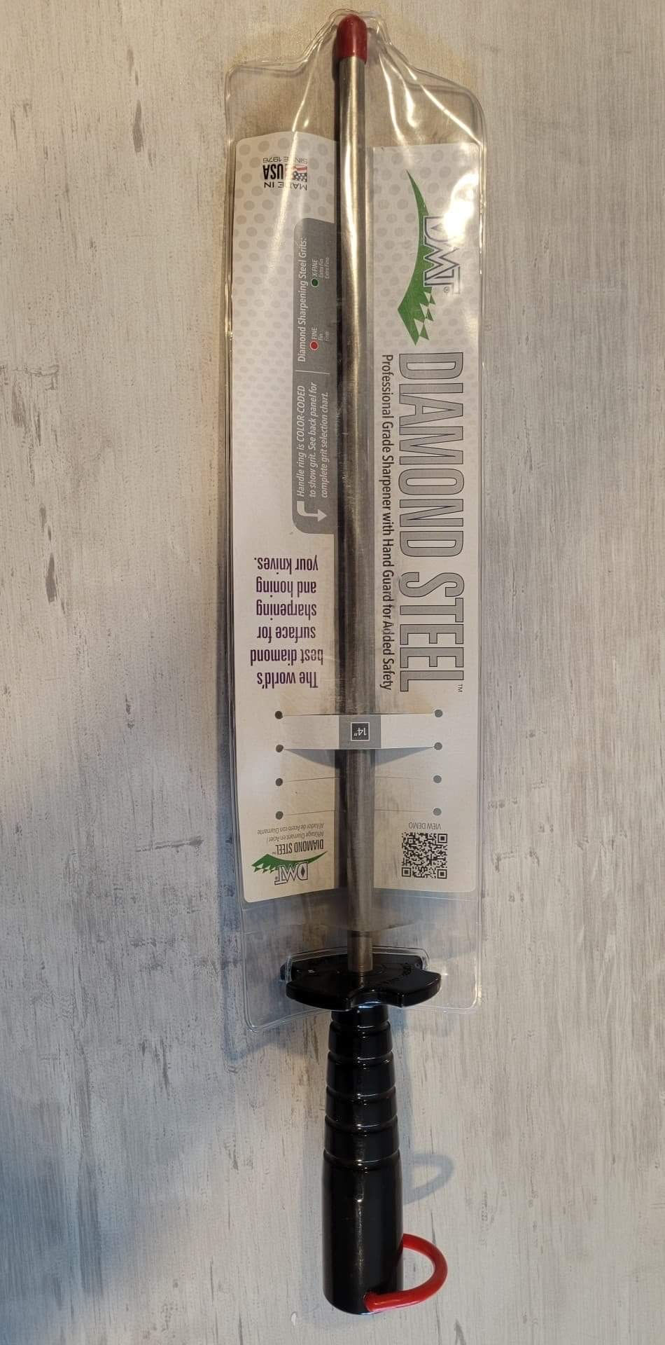 Cleaning rod with black handle in packaging