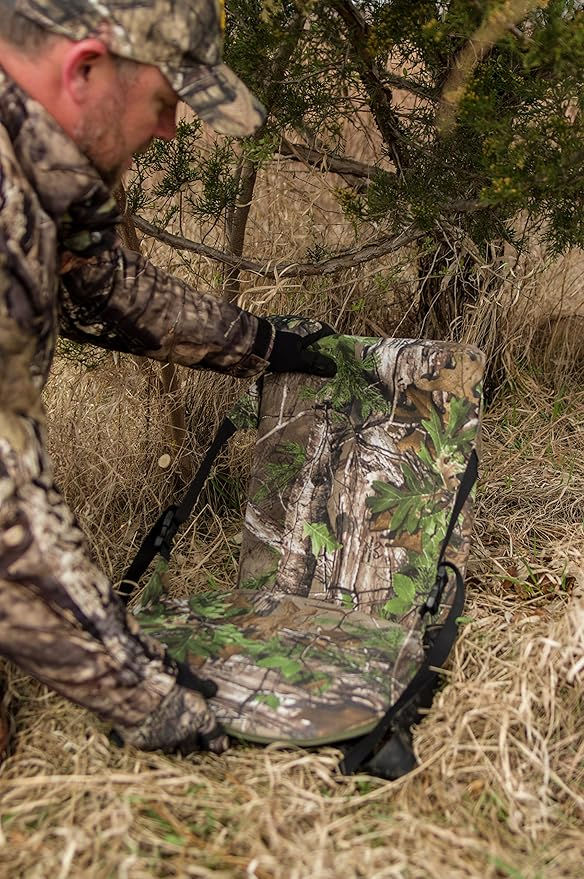 Hunter setting up camouflage blind