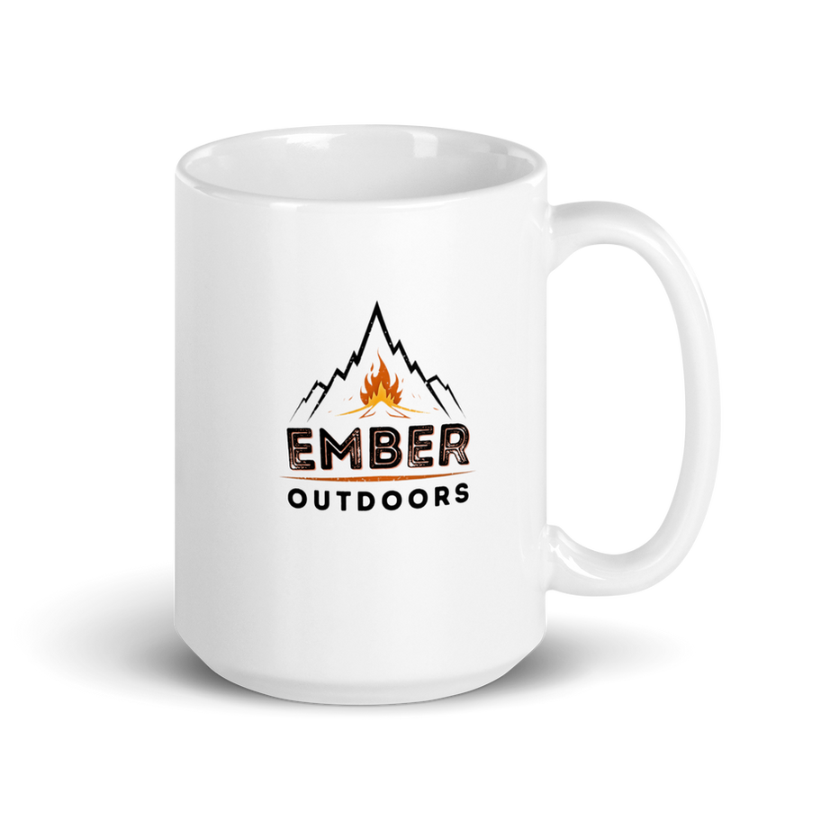 White mug with Ember Outdoors mountain and campfire logo