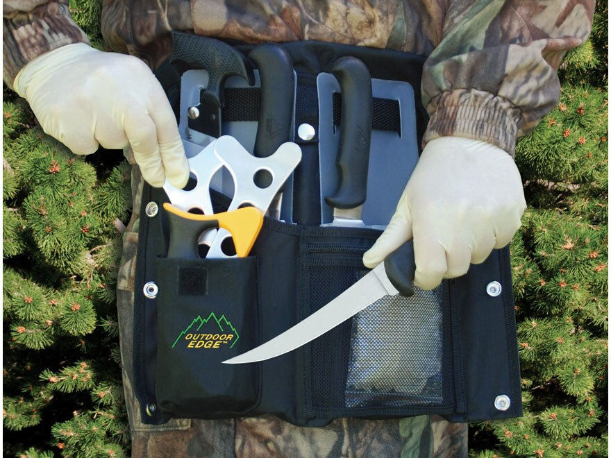 Person in camo gloves holding an outdoor knife kit with a fillet knife