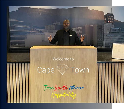 Man welcoming guests to Cape Diamond Hotel