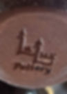 Pottery stamp featuring stylized 'Luz' with candle flame and 'Pottery' text.