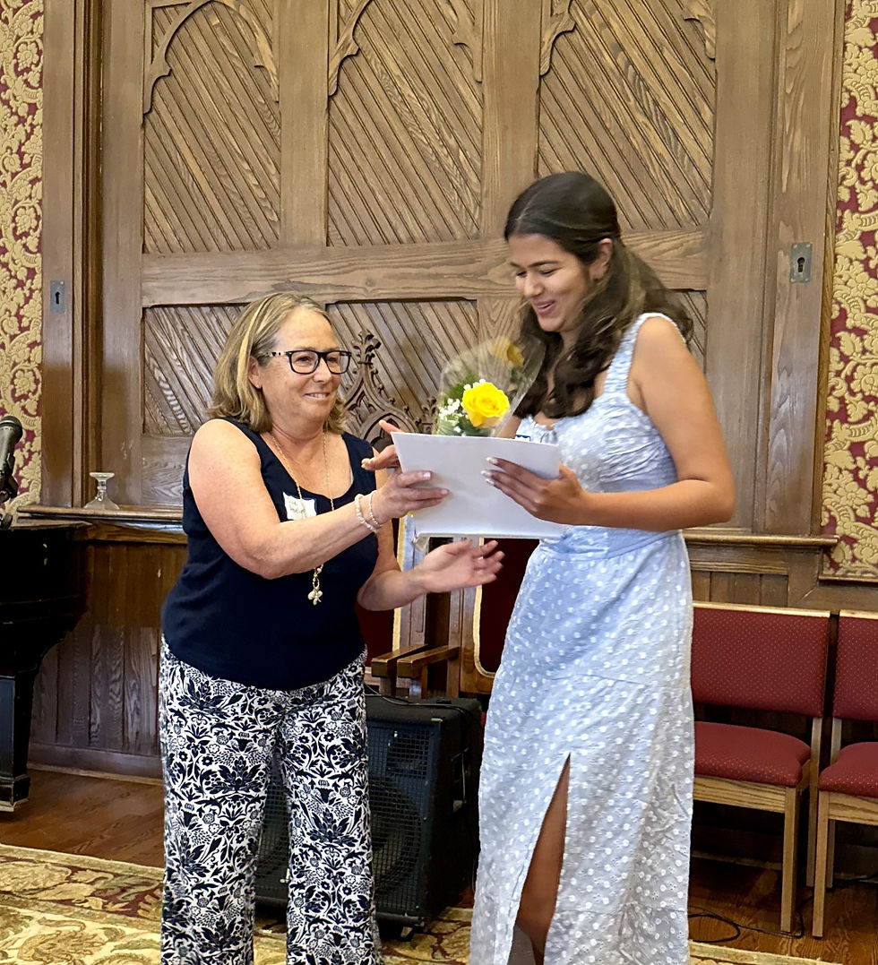 Committee member Susan Abely is delighted to give Ishita Yakav her scholarship award