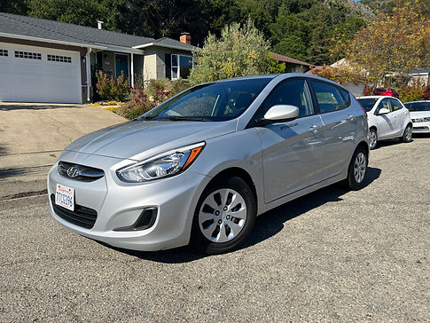 sporty, spacious, hatchback car, Hyundai Accent, that is economical, reliable, and cheap to rent