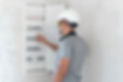 electrical-technician-looking-focused-while-working-switchboard-with-fuses.jpg