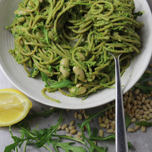 Overhead view of Balanced Imogen's super green matcha pesto linguine with rocket, pine nuts and lemon-a hormone-supportive, magnesium-rich lunch recipe for women from The Balanced Edit.