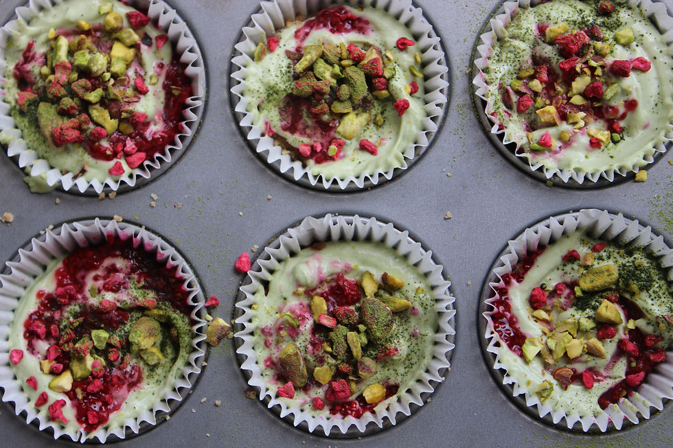 Overhead view of finished Marbled Raspberry & Matcha White Chocolate Freezer Cups in the tin.