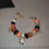Thumbnail: Women's valentines day orange, black and white snake chain bracelet with charms 