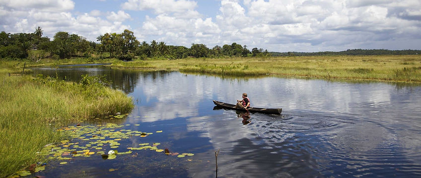 Hero-Guyana-Man-in-canoe-Photo-credit-Pixabay-David-Mark-scaled_edited.jpg