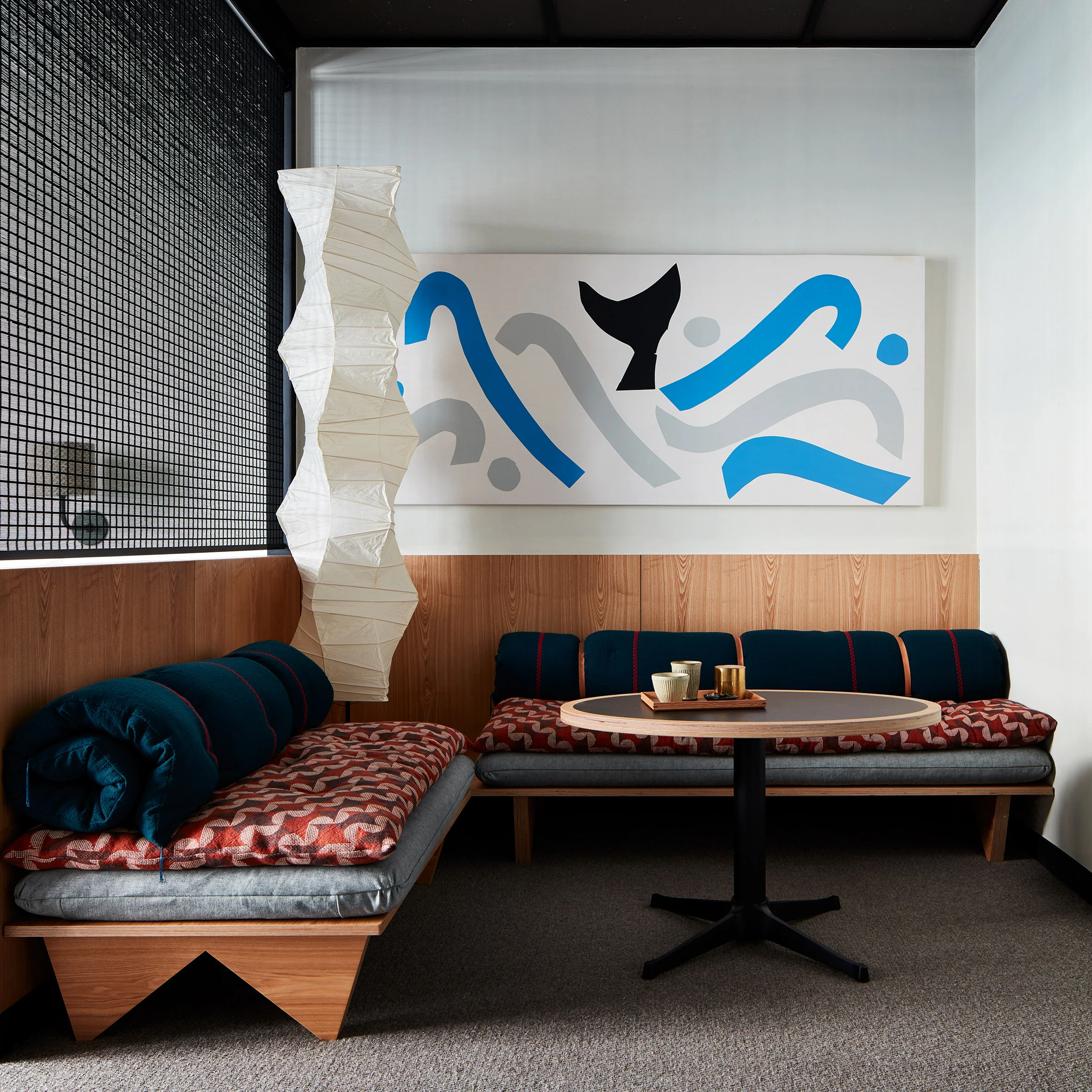 Cobalt blue art with noguchi lamp in the Ace Hotel Kyoto designed by Commune