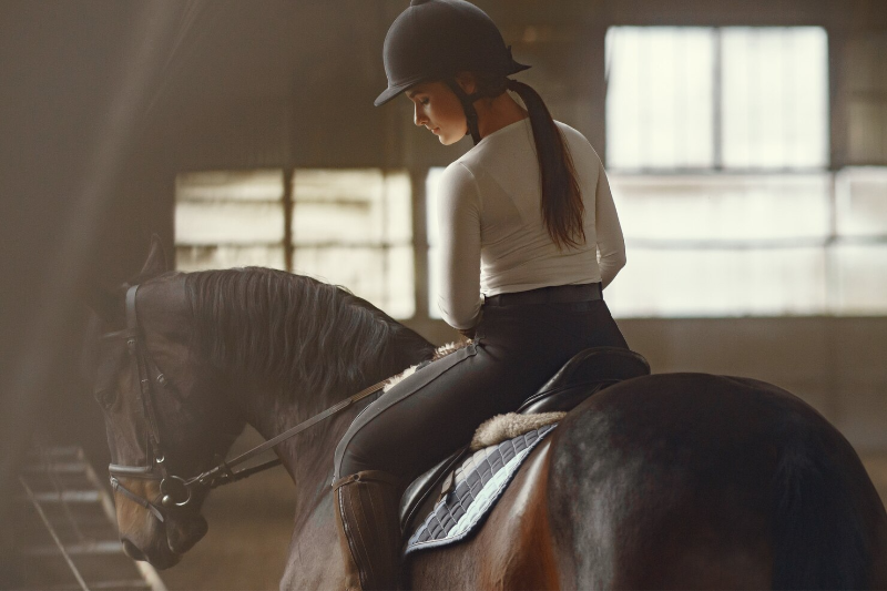 A girl riding a horse