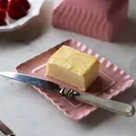 Pink butterdish with a red heart handle