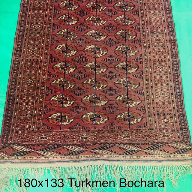 Handmade tribal antique rug, with lozenges and a rustic colour.