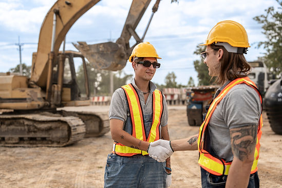 two-construction-workers-shaking-hands-at-a-constr-2025-05-05-17-11-29-utc.jpg