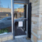 Front entrance of DazjaVu Styling Studio in Chicago, showing business hours and salon signage at 164