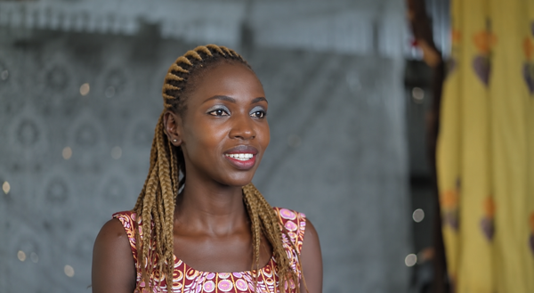 Warm Portrait of Smiling Braided Woman.png