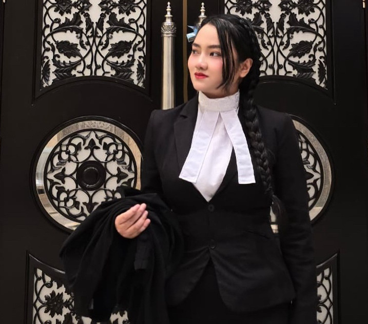 Nurul Syahida, partner, in court attire