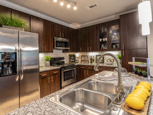 a kitchen with stainless steel appliances and granite counter tops