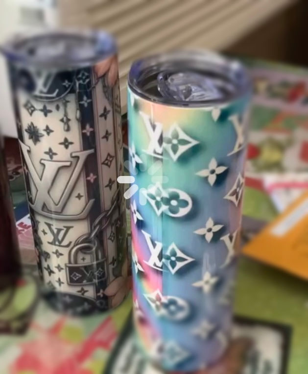 Boutique display featuring handmade tees and tumblers