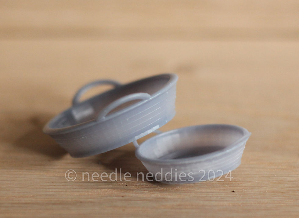Thumbnail: Two 3d printed grey feed troughs.