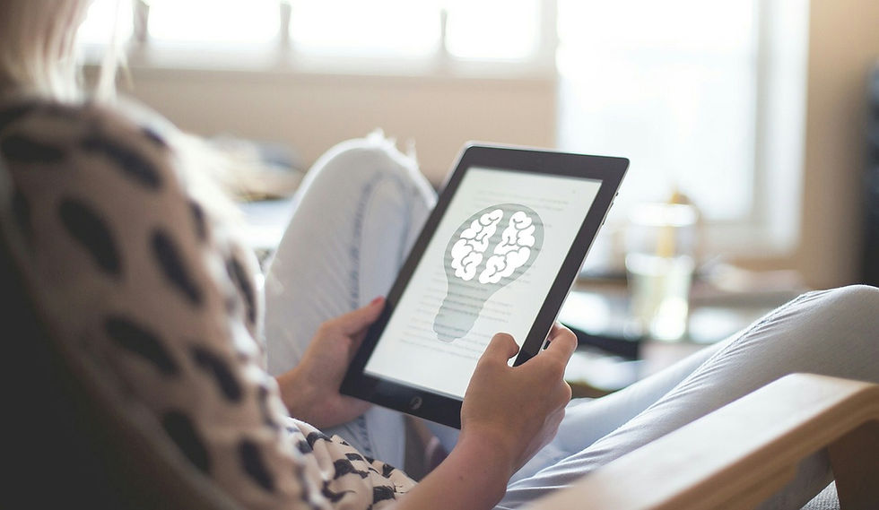 Woman sitting on chair holding a tablet