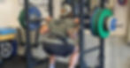 A man doing lifting at gym.
