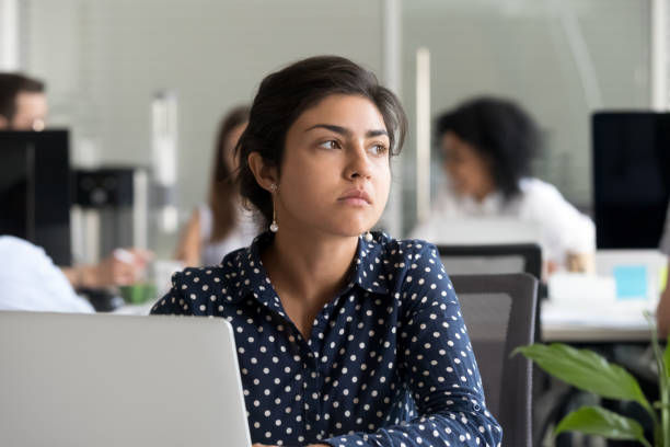 businesswoman looking away thinking