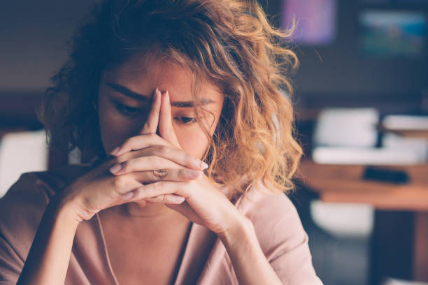 Closeup of sad young woman.