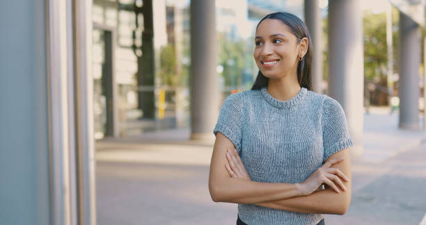 Shot of a confident young businesswoman standing with her arms crossed.