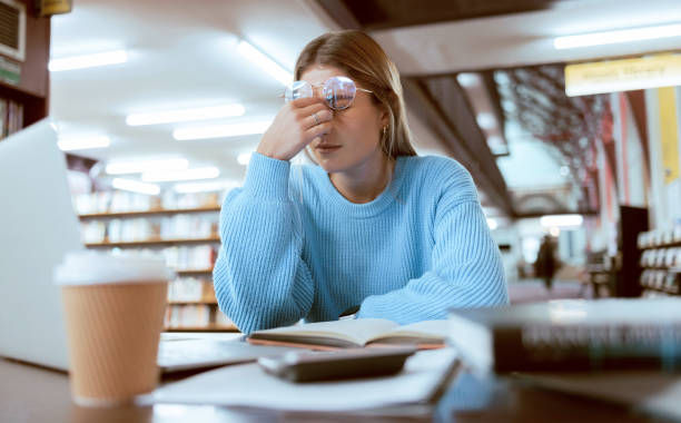 Woman student, fatigue with headache and university burnout.