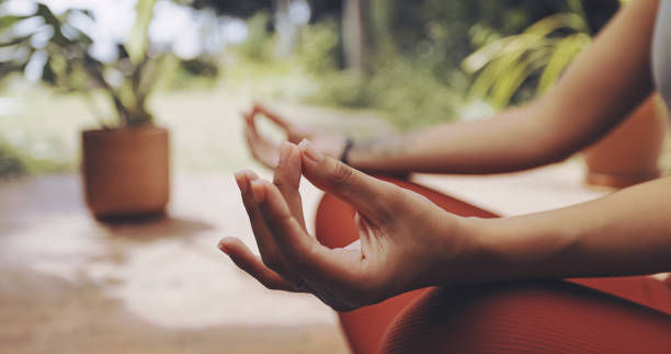 Woman meditate outdoors in lotus position