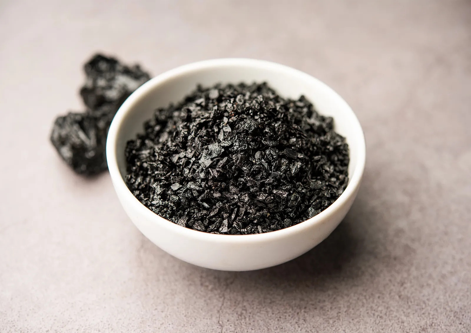 Purified Shilajit resin in a glass jar, a natural energy and vitality booster.