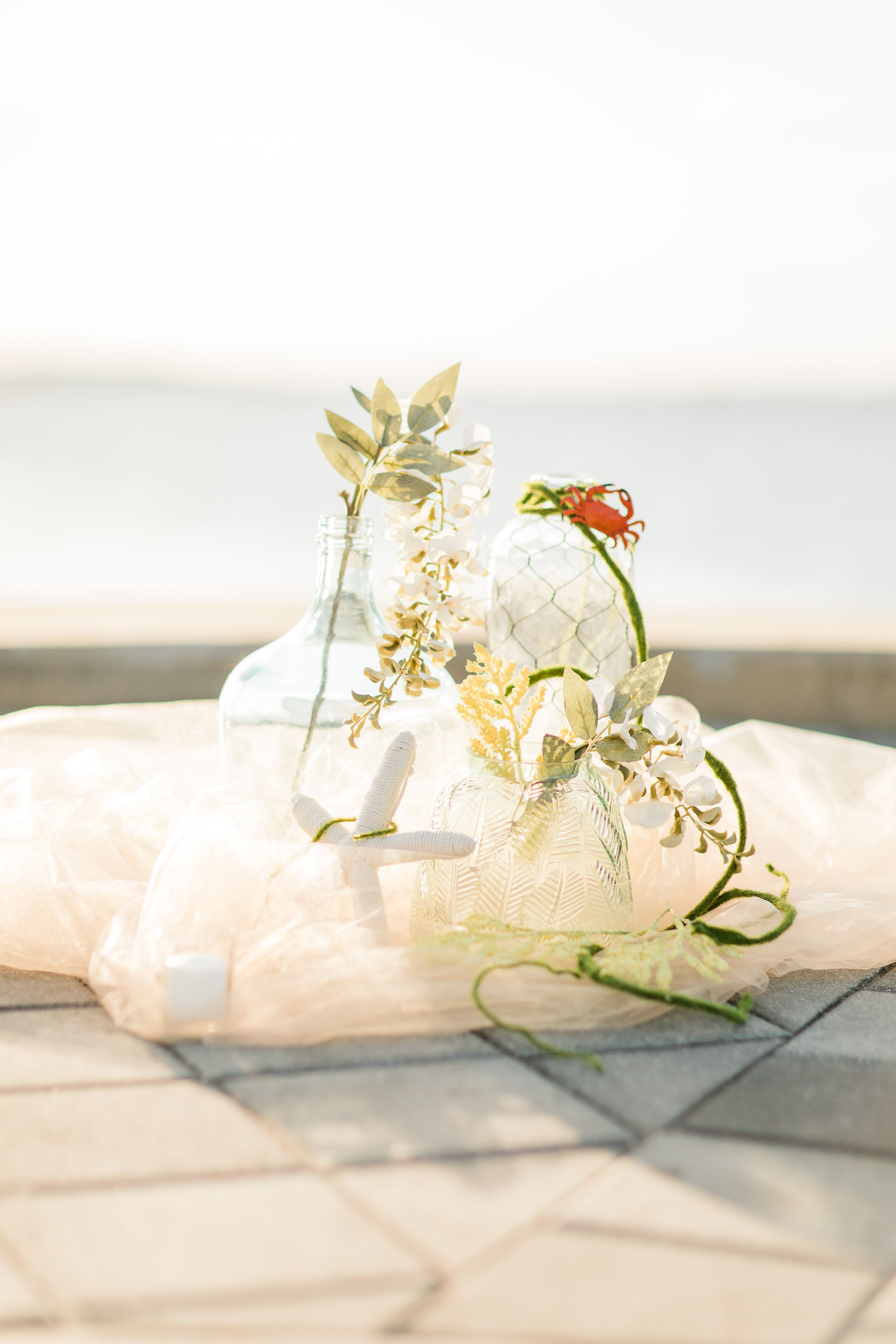 Ariel-inspired elopement, The Little Mermaid wedding decor, lake elopement, silk flowers