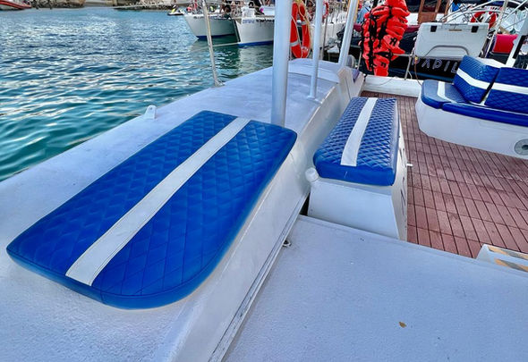 Seating area on a private catamaran tour in Cabo.