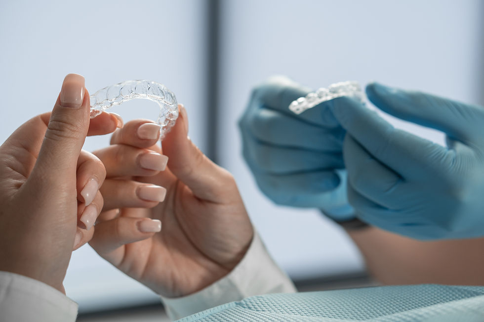 a doctor holding occlusal splints