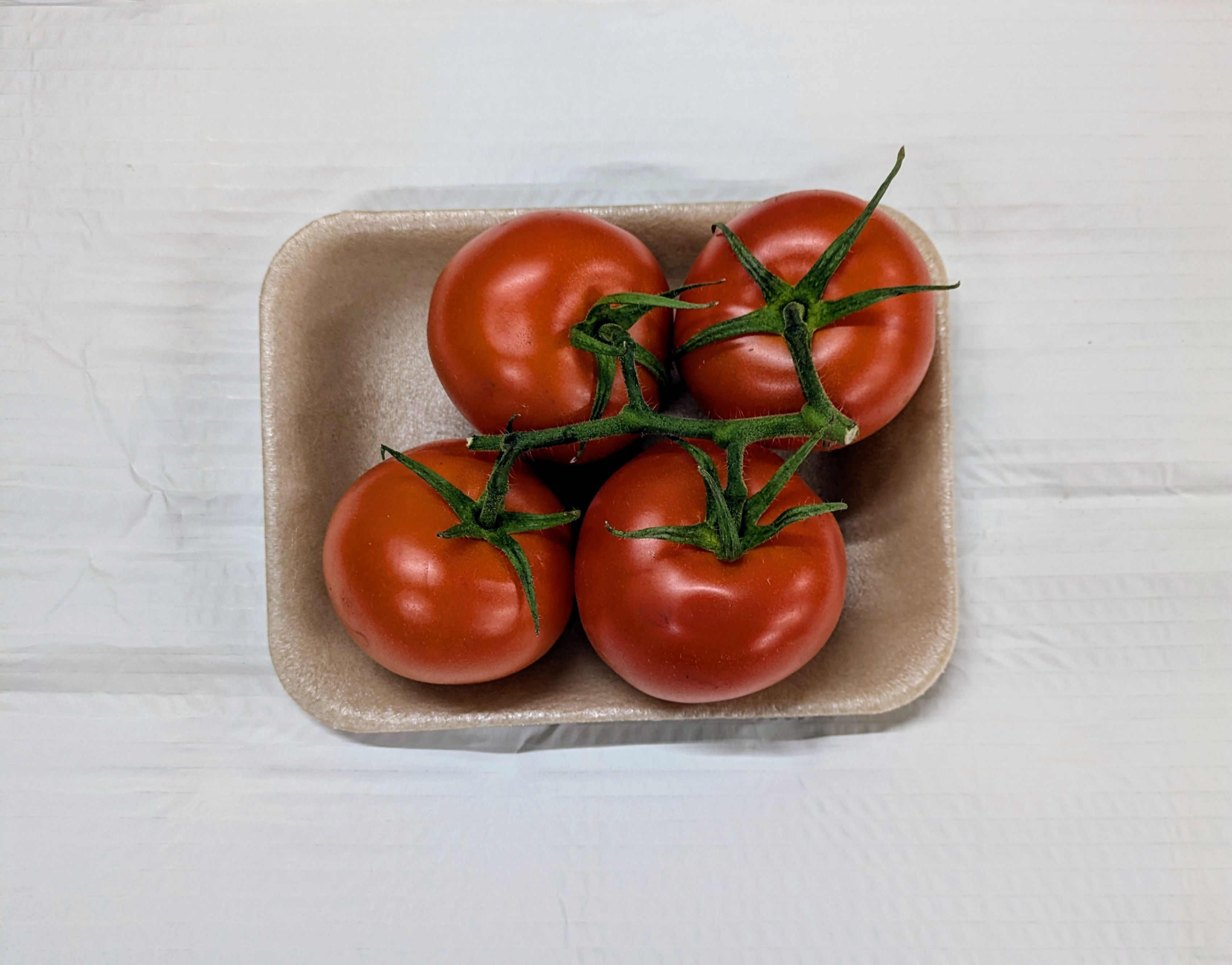 Pre packed vine tomatoes price marked £2.49