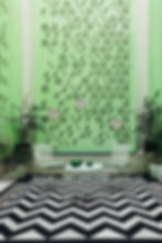 green seating area in dileep kothi with tea chairs and tea set up