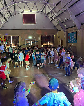 Kids Dancing to the Hokey Pokey