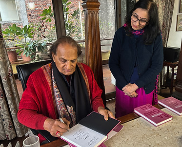 Raghu Rai signing first copy of book.jpg