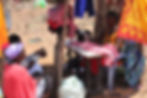 A local Maasai woman running a sewing business to make school uniforms, demonstrating community empowerment and sustainable income projects.