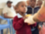 A young girl receiving support at a community health clinic in the Magadi region, supported by Memusi Foundation healthcare initiatives.