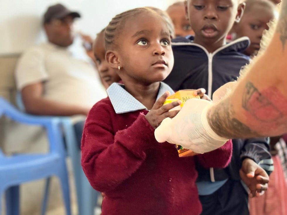 A young girl receiving support at a community health clinic in the Magadi region, supported by Memusi Foundation healthcare initiatives.