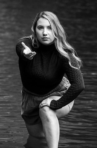 girl in water reaching