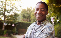 Portrait Of Mature Man In Back Yard Gard